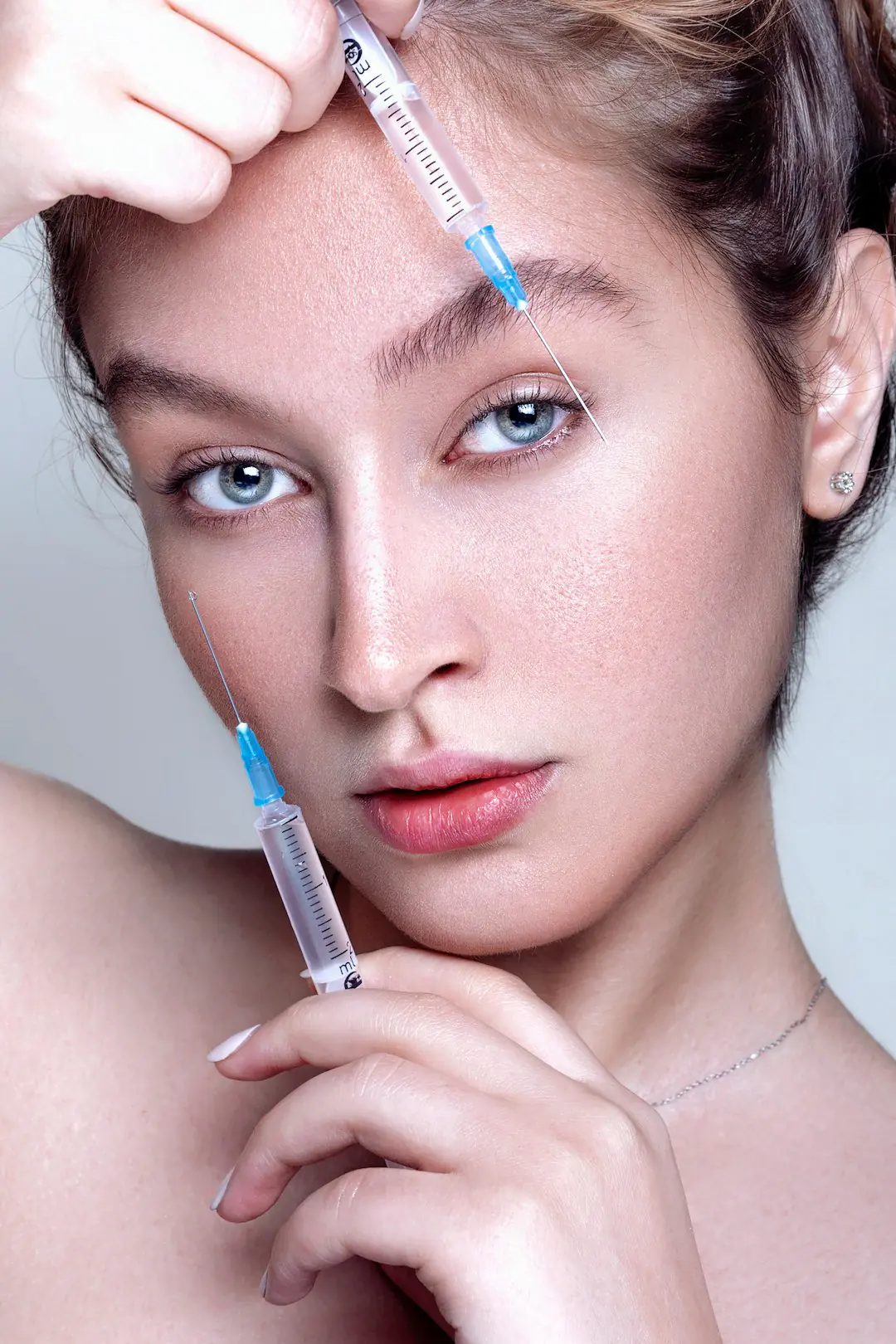 Photo by MohammadReza BaBaei a woman with a needle in her hair