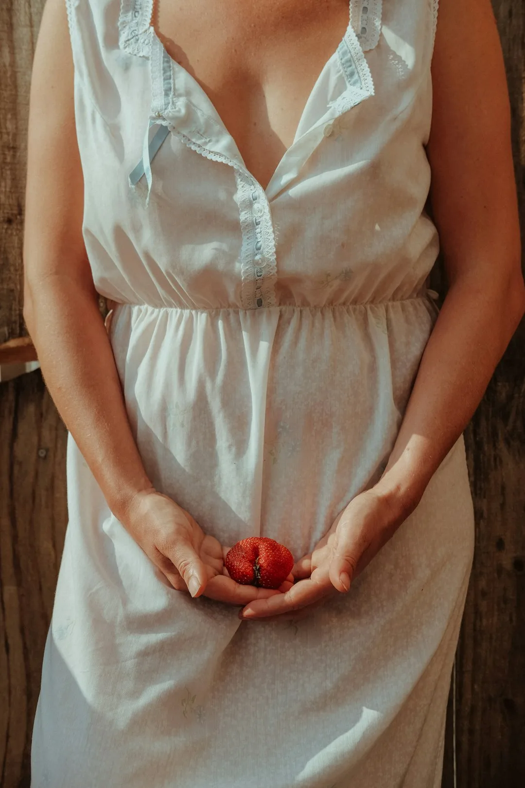 Photo by Ayla Meinberg unknown person holding red fruit
